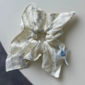 Detail of floral bow scrunchie with lace edge, blue flower pattern and button decor - Blue Scarf Scrunchie