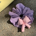Detail of blue plaid fabric hair tie with pink plush bow in Korean balletcore style - Purple