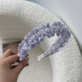 Detail shot of lilac tulle lace headband with ruffled layers on soft white background - Purple Ruffled Headband