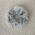 Close-up of floral hair scrunchie with light blue patterns and sheer lace trimming detail - Blue Toned Floral Lace Style (Model F)