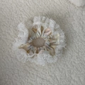 Detailed view of floral scrunchie with layered white lace edges on soft white background - Soft Floral Lace Style (Model C)