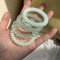 Set di 4 elastici per capelli a spirale in colori pastello come verde menta e resina chiara - Sistema Verde