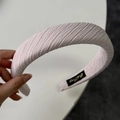 Close-up of light pink headband with pleated diagonal texture and soft sponge padding - Wide Pink