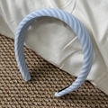 Close-up detail of light blue and white striped fabric texture on a wide padded headband - Wide Blue Stripe