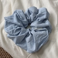 Detail of blue and white striped fabric scrunchie with soft cotton texture and elastic band - Blue White Striped Scrunchie