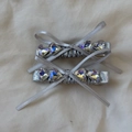 Close-up of two silver ribbon bow hair clips with shimmering AB rhinestone centers - Bow Hair Clip (Single)