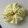 Detail of light yellow scrunchie with heart print and premium white fabric label - Yellow Scrunchie