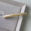Elegant marble pattern acetate hair barrette with Barrette La France gold lettering - Milk Coffee