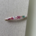 Close-up of pink and green marbled acetate hair clip with gold metal clip and handmade engraving - Marble Pink Green