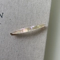 Detailed close-up of iridescent acetate leaf hair clip with France Handmade marking - Mermaid Color