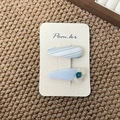 Close-up of light blue floral fabric hair clips with lace trim on a card display - Button Teardrop Style