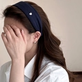 Detail of navy blue wide fabric headband with small silver heart metal accent on hair - Navy Blue