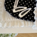Set of two silver metallic drop-shaped hair clips on elegant lace and polka dot fabric - Waterdrop Style