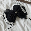 Detail of black pleated chiffon hair claw with white lace trim and gold button - Black