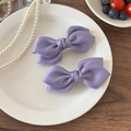 Paire de barrettes à nœud en satin violet pour femmes avec une texture de soie élégante - Violet