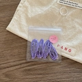 Detail view of 4-piece set of purple plaid hair clips in elegant thank you packaging - Purple Plaid
