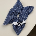 Detailed macro shot of blue checkered scrunchie with lace edges and a small ribbon bow - Striped Streamer Style