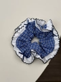 Close-up of blue plaid scrunchie with white lace edges and navy ribbon bows - Blue Gingham Style