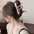Detail of a large marble texture bow hair claw clip styled on woman's hair - Straight Claw / Coffee