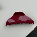 Macro detail of the wine red acetate hair claw clip with golden Barrette la France text - Burgundy