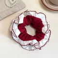 Chic retro red and white scrunchie with ruffled edges for elegant low ponytail styling - Red