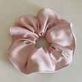 Detail of pink fabric scrunchie showing fine twill texture and Hand Made label tag - Pink