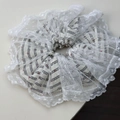 Detail of red heart patterned stripes and white lace edges on a sweet ballet hair scrunchie - Black Striped Lace Scrunchie