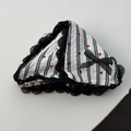 Close-up of heart print hair scrunchie with striped fabric and black lace trim detail - Black Stripe Claw Clip