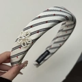 Detail of sponge headband featuring red hearts, black stripes and pearl flower applique - Black Stripe Headband