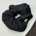 Minimalist black wrinkled scrunchie with a vertical stripe texture and Hand Made label - Black Scrunchie