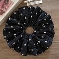 Elegant black oversized scrunchie with white polka dots and pleated fabric texture - Black