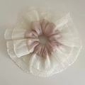 Macro view of oversized satin and lace scrunchie in pink and white pleated mesh - Pink