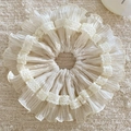 Detail view of cream-colored chiffon scrunchie with double-layered lace embroidery edges - Off-white Style B