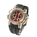 Detailed close-up of iced out gold plated luxury watch case with red dial and black strap - Gold and Black Strap