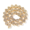 Detailed macro view of heart-shaped links with emerald-cut zircon and pave diamonds - 16" / Gold
