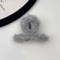 Detailed view of the soft grey faux shearling plush texture on this large hair claw clip - X-Shape Claw