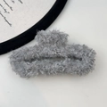 Close-up detail of grey plush faux fur hair claw clip for elegant women styling - Rectangular Claw Clip