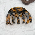 Detail of tortoise shell acetate hair claw with gold France Handmade logo on white background - Octopus Style Dark Tortoiseshell