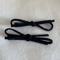 Elegant pair of black suede bow hair clips with minimalist lacquered metal duckbill design - Black