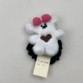 Primer plano de coletero de oso de peluche blanco con lazo rosa y banda elástica - Goma de Oso Blanco Crema