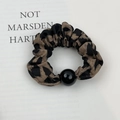Close-up of leopard print fabric scrunchie with a sleek black bead detail for ponytails - Dark Brown Leopard (Style B)