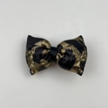 Detailed view of the leopard print jacquard bow hair clip with gold and black metallic finish - Bowknot Duckbill Clip