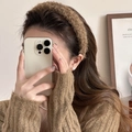 Detailed close-up of a wide dark brown plush headband with fuzzy texture and cozy style - Brown