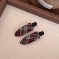 Close-up of red and grey plaid fabric hair clips with black metal alligator base - Red and White Striped