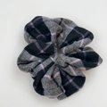 Detailed close-up of a plaid hair scrunchie with grey and purple wool texture fabric - Grey Scrunchie