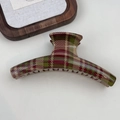 Close-up of a large red and green plaid shark hair clip with glossy resin finish - Hanger Shape Light Plaid