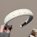 Detailed texture of thick white sponge headband with black polka dots and label - Off-white Headband