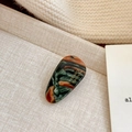 Retro acetate hair clip with green and orange marble pattern and gold lettering - Oval Hair Clip