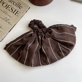 Detail of dark brown striped oversized scrunchie with pleated suede fabric texture - Skirt Style Scrunchie