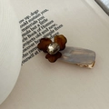 Detail of iris floral hair clip with large crystal center and marble resin base - Khaki Brown Flower On Gray Base